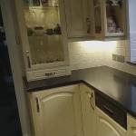The kitchen with its freshly glittered tiles by the window