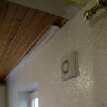 The same finish carried up under the beams and round the extractor