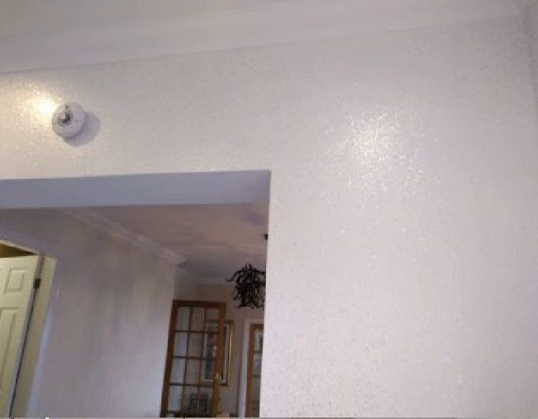 The sparkling white walls continuing through the archway