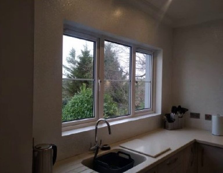 The finish carried around the kitchen window and sink