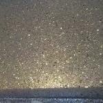 The gun metal glitter catching the light up close