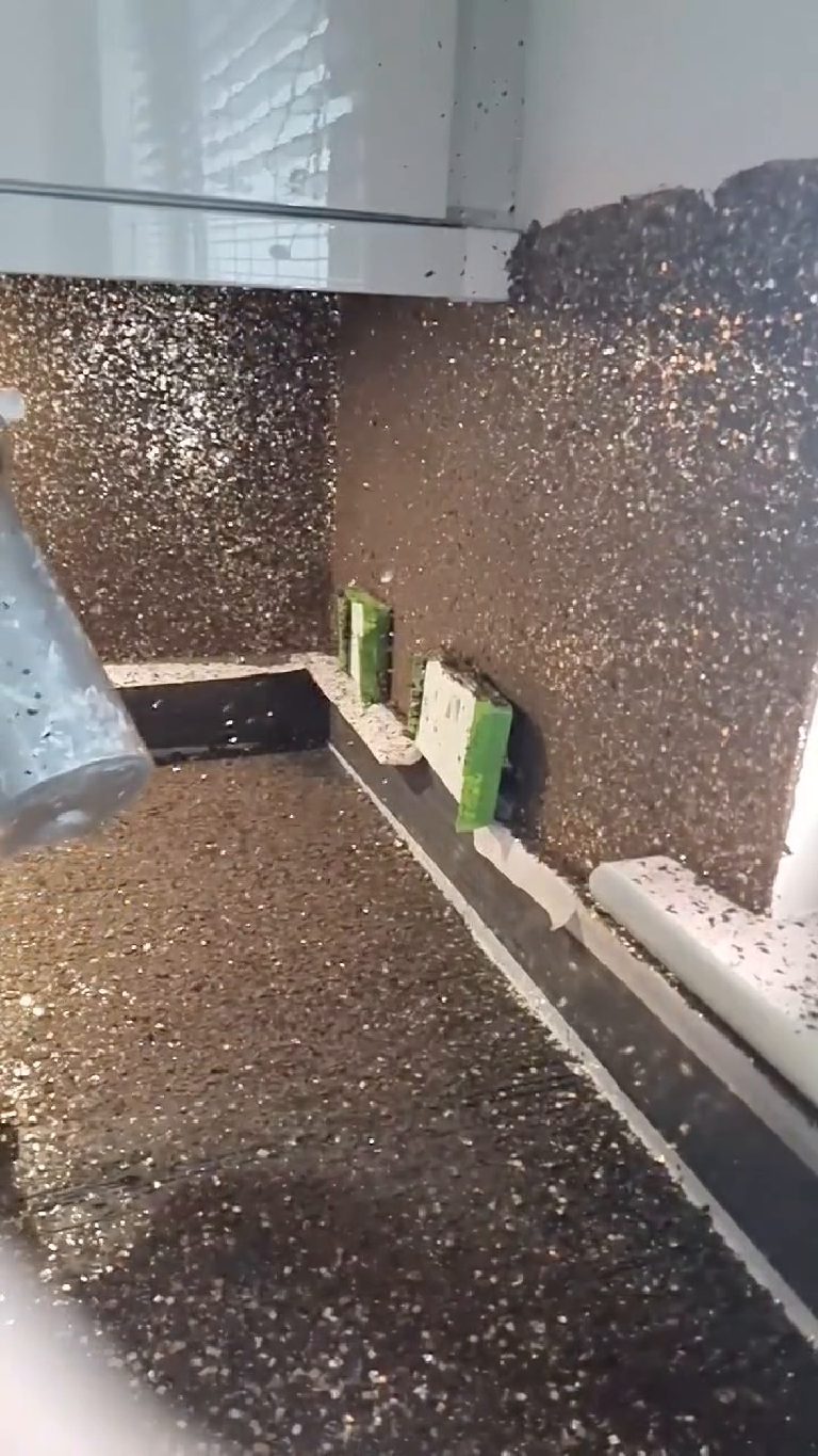 The panels fully covered and the worktop below deep in loose flake
