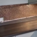 The flake up close, copper and gold packed edge to edge around the sockets