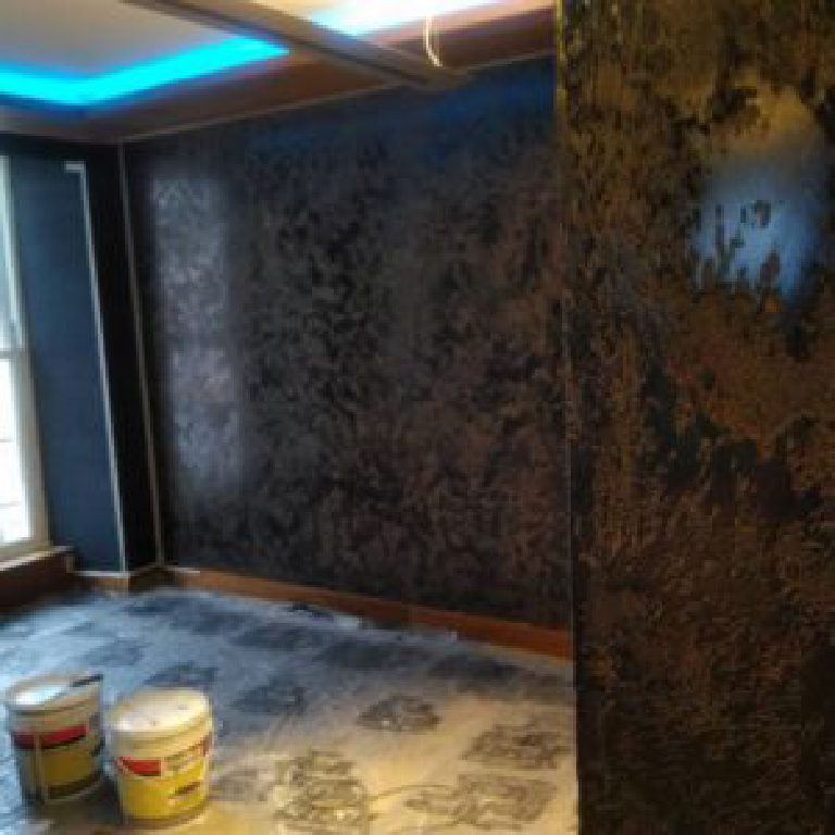 Black Marmorino going onto the walls, buckets on the floor