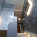 Grey Marmorino with silver wax lining the stairwell