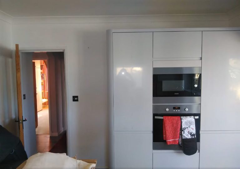 Bare white walls by the tall units before the Marmorino