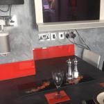 The dining corner set for two against the Marmorino wall