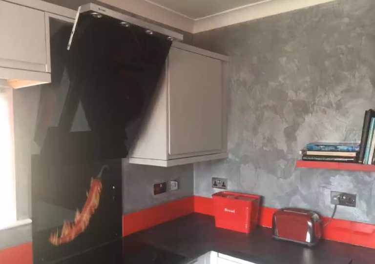The chilli splashback and red accessories against the grey walls