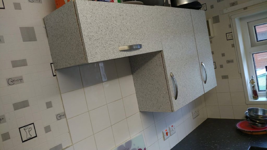 The wall units transformed, same doors, same handles