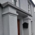 The rendered porch, the cork taken over the columns, caps and lintel