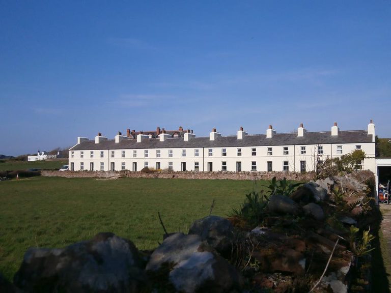 Showing application of lime render and mineral paint