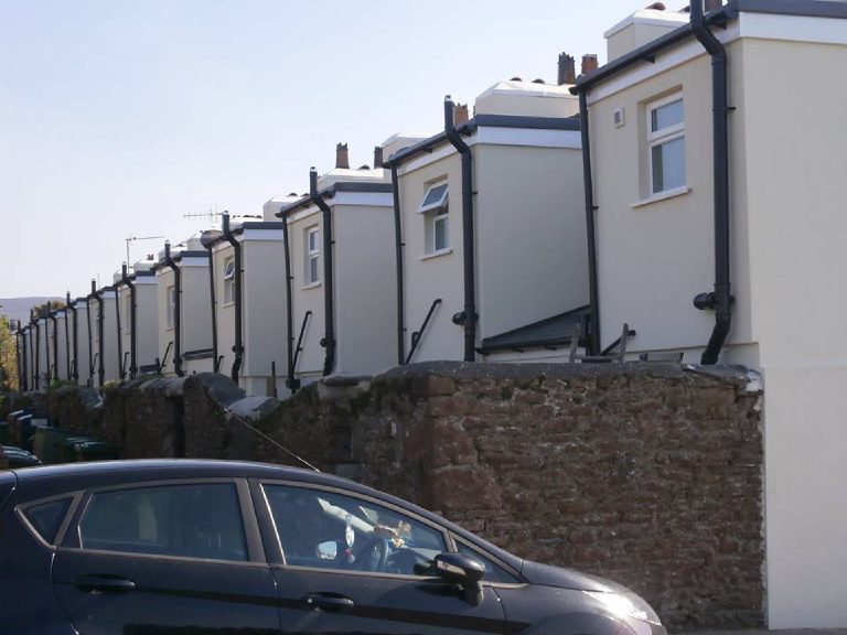Showing application of lime render and mineral paint