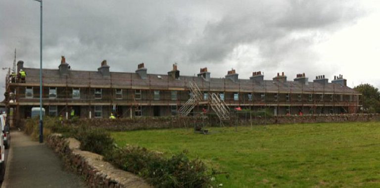 Photographs showing the extensive scaffolding required and the existing underlying Peel sandstone substrate