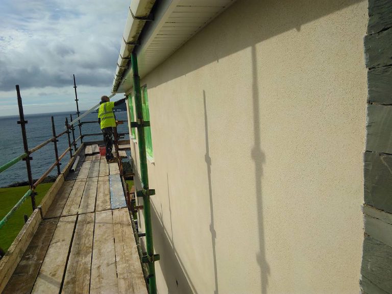 The render going on along the seaward elevation from the scaffold