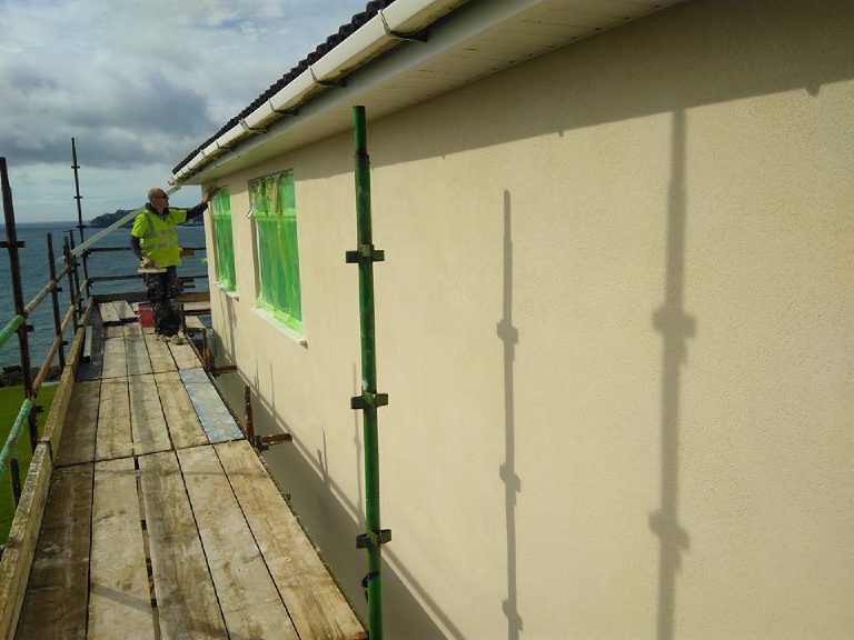 The coated elevation, windows still taped green