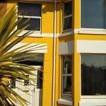 The finished front of Lyncroft in yellow and white