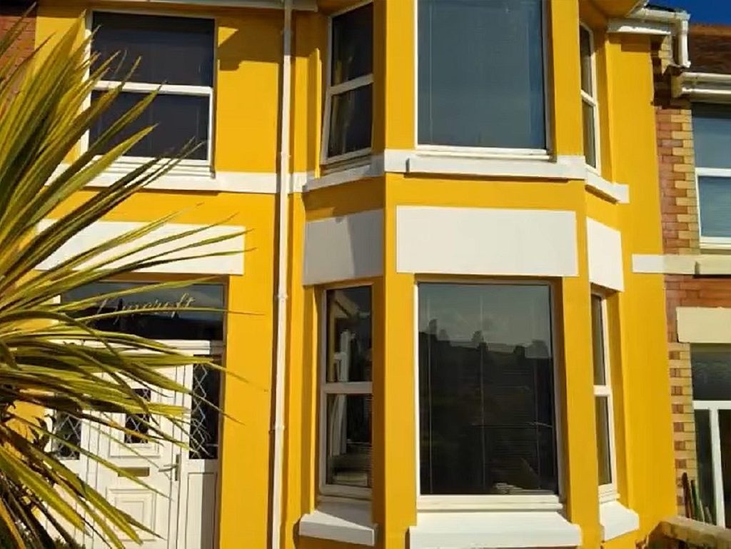 The finished front of Lyncroft in yellow and white