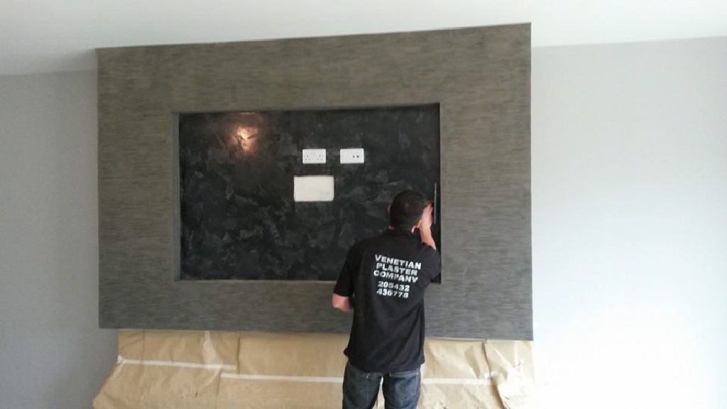 The stone-effect fireplace with its black base