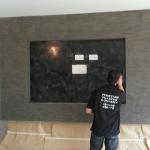 The stone-effect fireplace with its black base