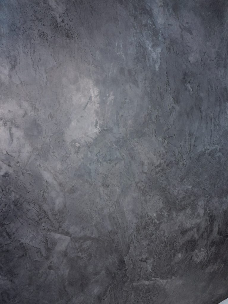 Slate grey MicroCement up close, showing the mottled tonal variation