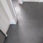 The new floor running under the kitchen units