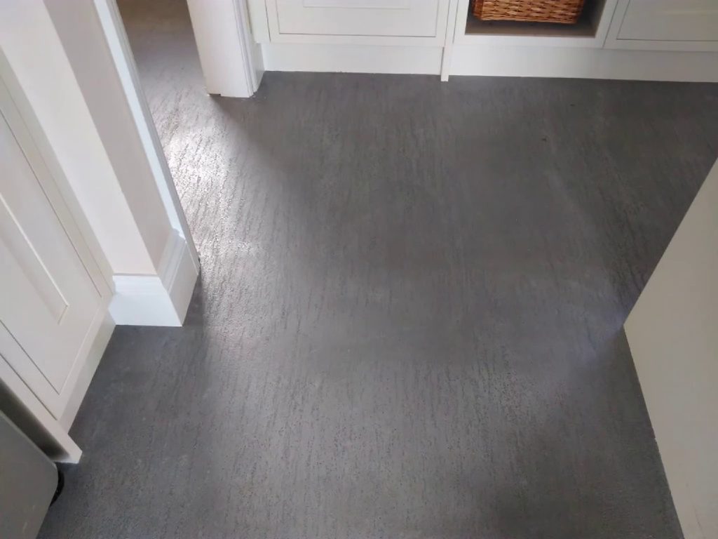 The new floor running under the kitchen units