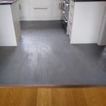 The finished floor flowing up to the oak boards next door
