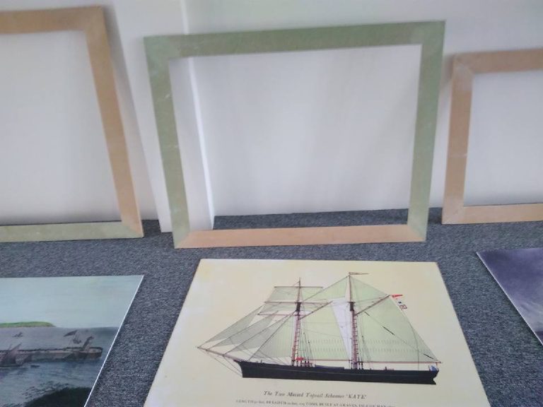 White base-coated frames drying on the tarpaulin