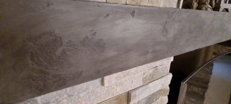 Close-up of the blotched, aged microcement surface on the shelf top
