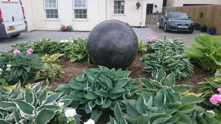 The slate-grey sphere in the garden