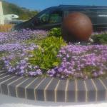 The finished rust sphere in its flower bed