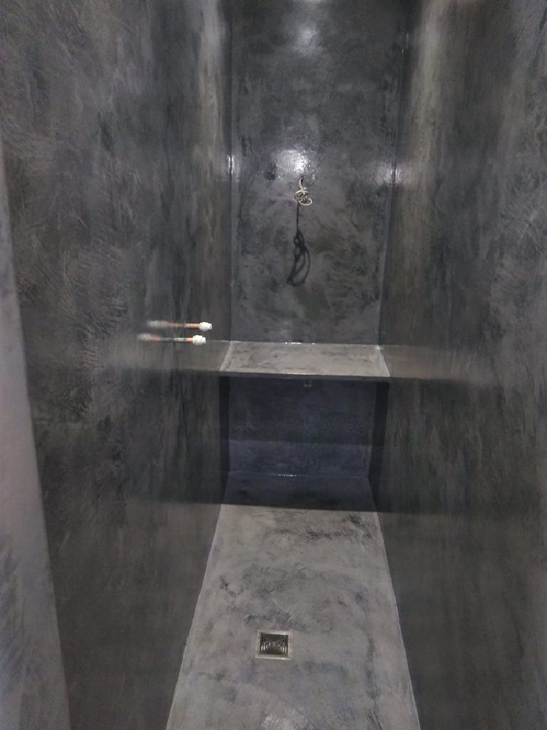 The sealed and polished wet room — walls, bench and floor in one surface