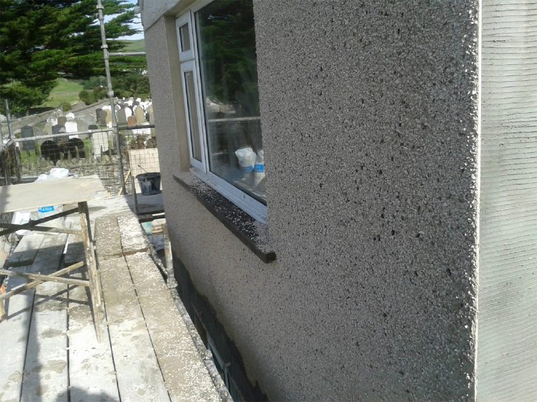 Finished pebbledash gable and corner detail