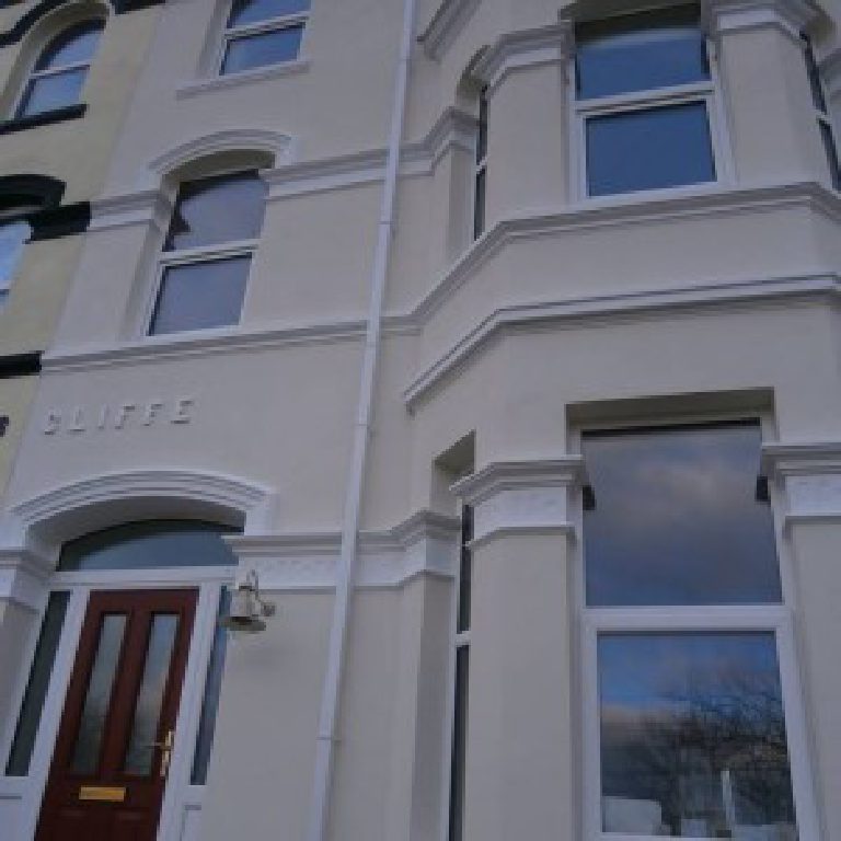 The front of the house with the raised RAVENSCLIFFE lettering above the door