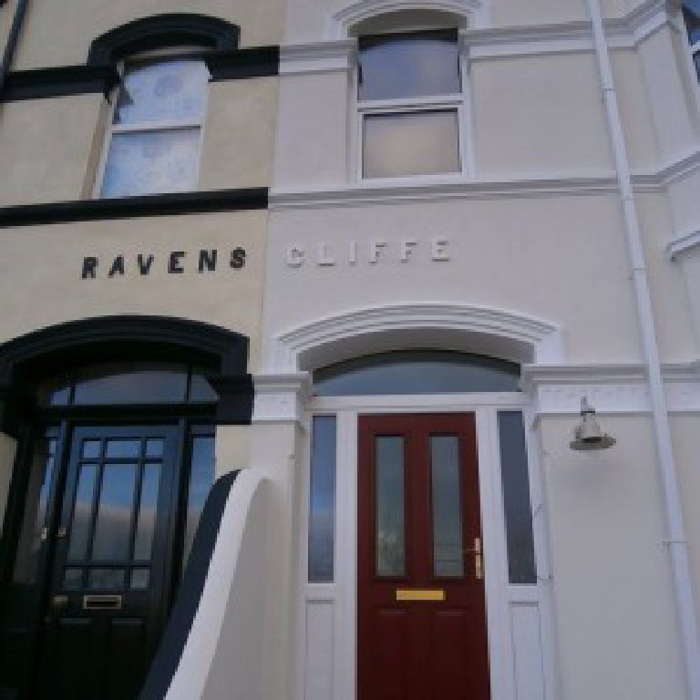 Close view of the entrance, RAVENSCLIFFE lettering over the red front door