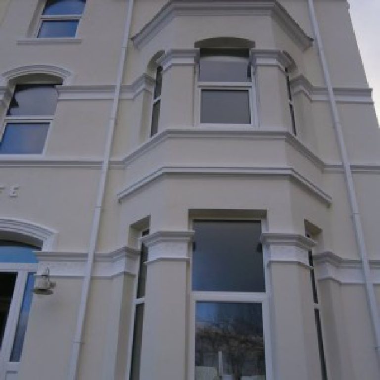 Looking up the front bay, cornice bands and moulded window surrounds picked out white