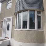 The curved bay after the work, cork render taken round it in one even surface