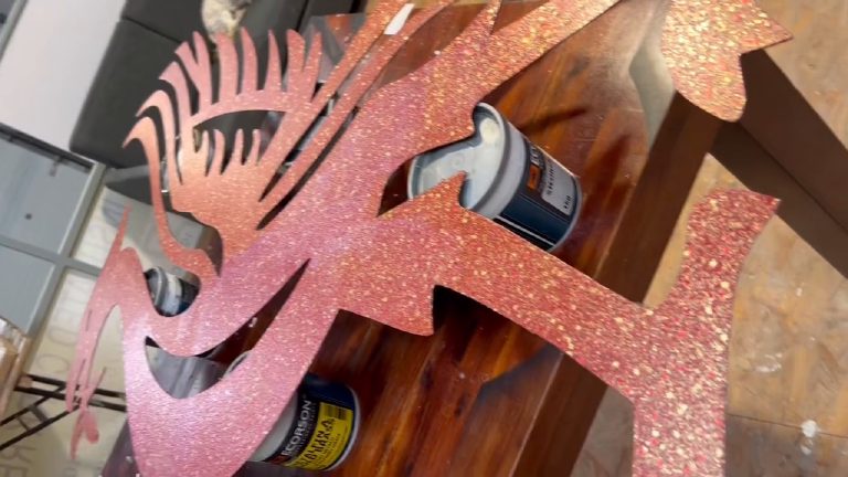 The head and crest feathers, each slot cut clean through
