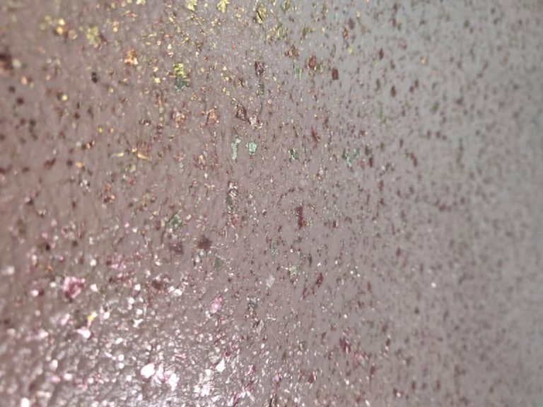 Close up of the pink Ilumitextra flakes, pink, gold and green