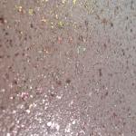The pink Ilumitextra flakes up close, pink, gold and green under the lacquer