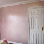 The pink glitter wall running up to the white double doors