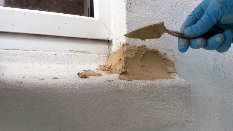 Applying the mineral-based repair material