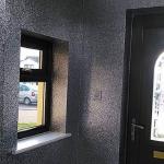 The glittered walls around the porch window and door