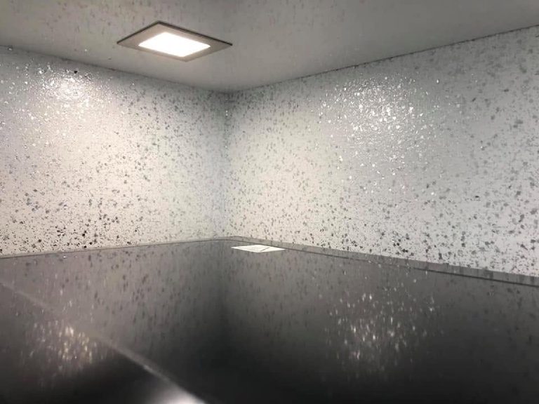 The finish turning an internal corner above a dark glossy surface