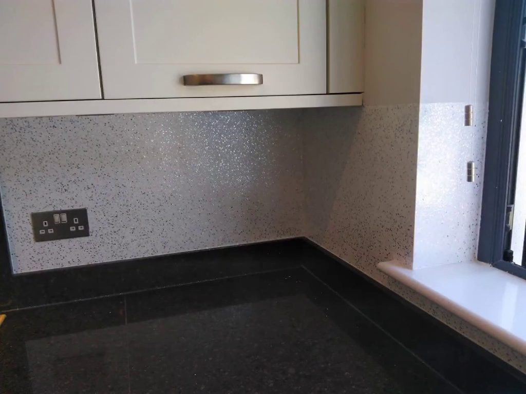 The splash back wrapping the corner over the granite