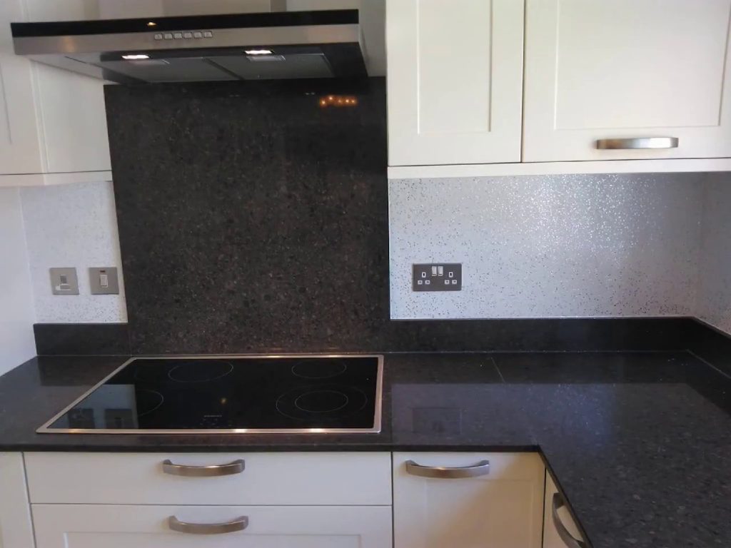 The flake splash back behind the hob and extractor