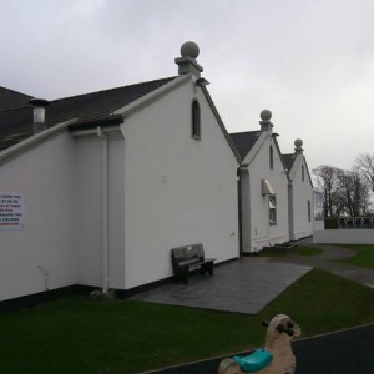 The gabled bays along the side of the pub, each topped with a ball finial