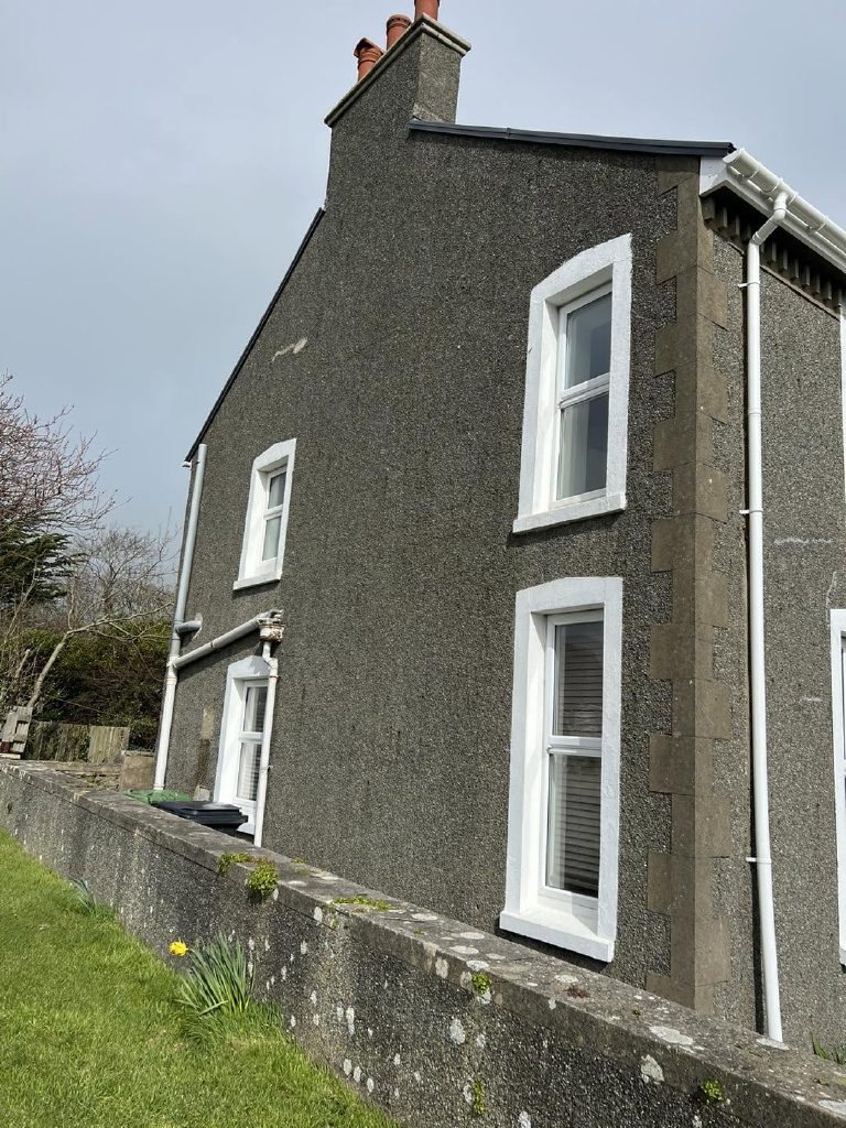 The gable and side elevation before, dash and stone quoins at the corner