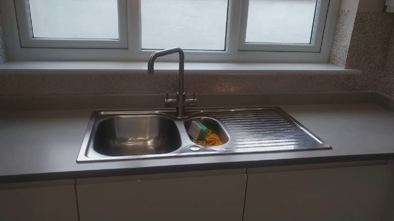 The glitter walls either side of the window above the sink