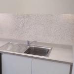The utility room with the same white and copper glitter behind the worktop
